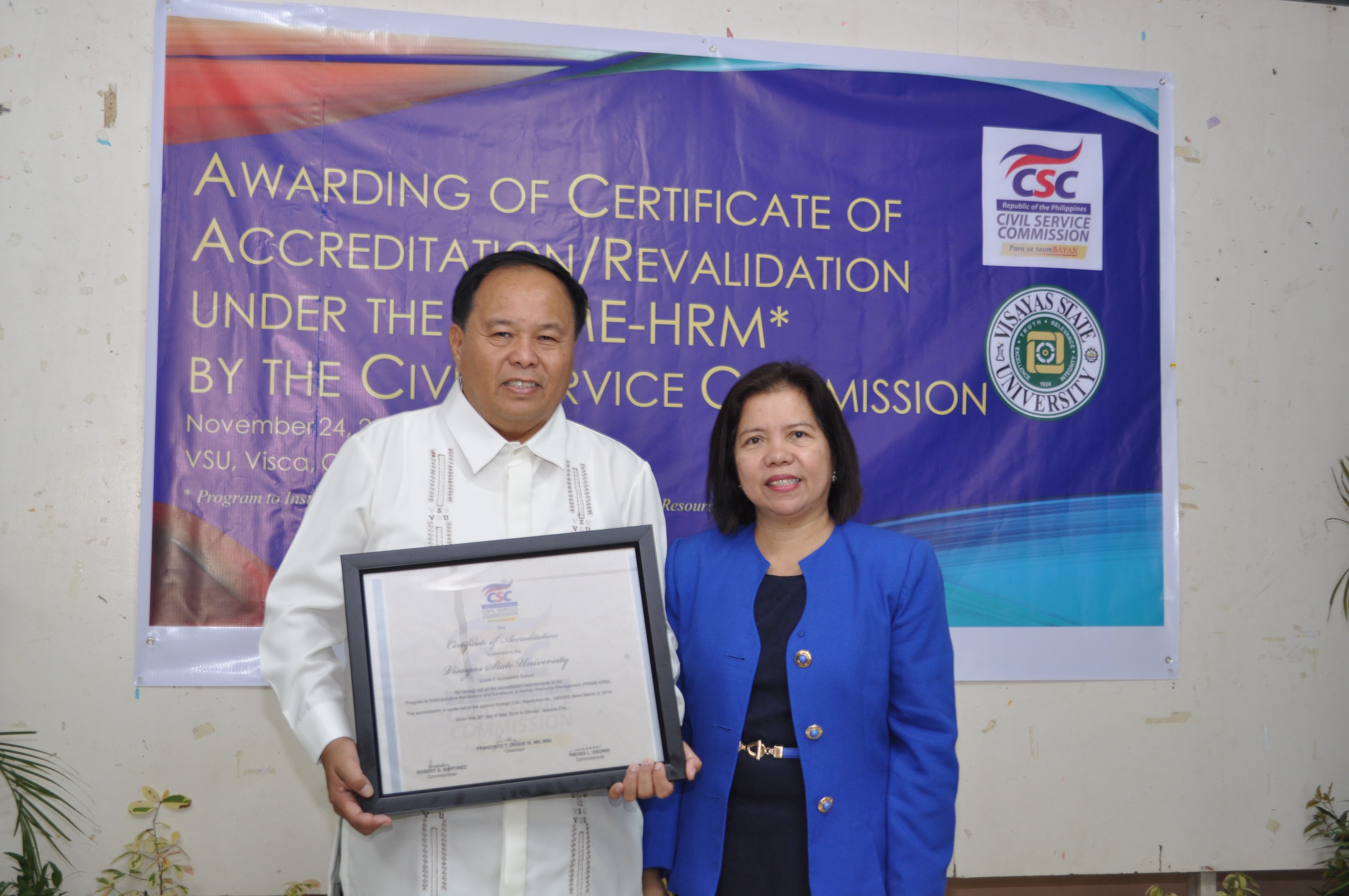 Dr. Jose L. Bacusmo and Dir. Pharida Q. Aurelia posing during the awarding of Certificate of Accreditation to VSU. Dr.-Jose-L.-Bacusmo-and-Dir.-Pharida-Q.-Aurelia-posing-during-the-awarding-of-Certificate-of-Accreditation-to-VSU.