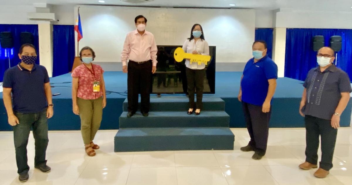 Key officials of the Office of the Vice President for Research, Extension and Innovation (OVPREI) pose for a photo op in a simple turnover ceremony.